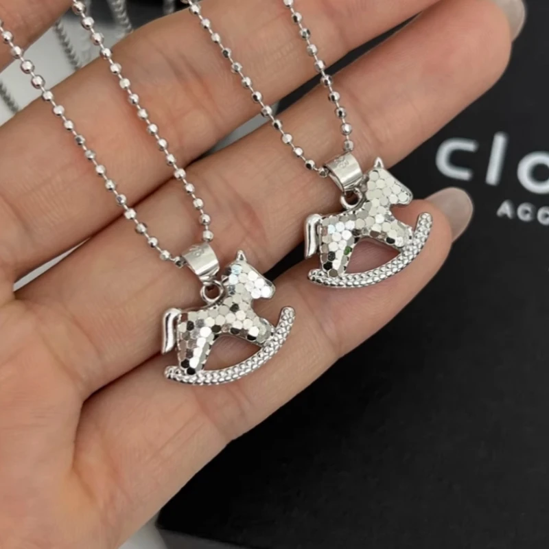 Close-up of the pendant and clasp on the Star Moon Necklace