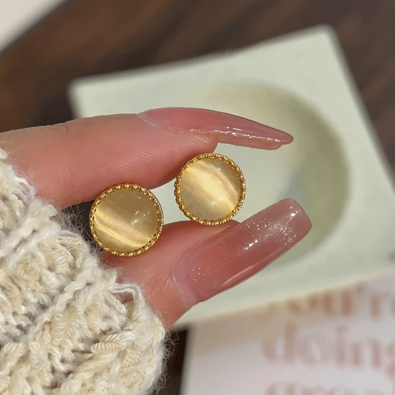 Angled view of the 14K Gold-Plated  Elegant Cat's Eye Stone Hoop Earrings