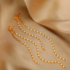 Angled view of the Sterling Silver Elegant Chain Tassel Earrings