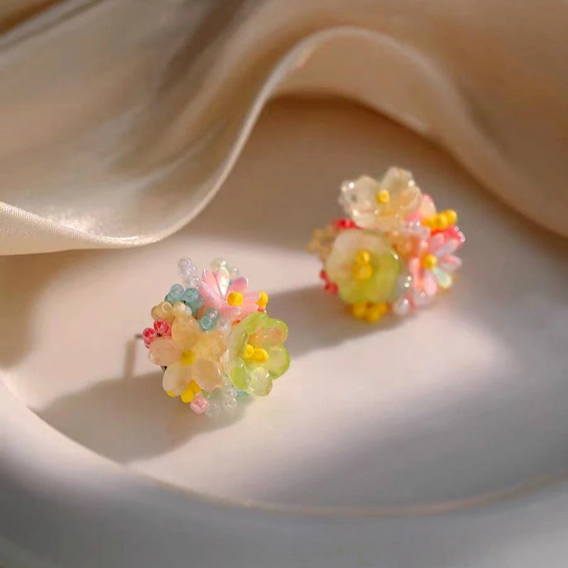 Close-up detail of the sparkling zircons and plating on the Face Hoop Earrings