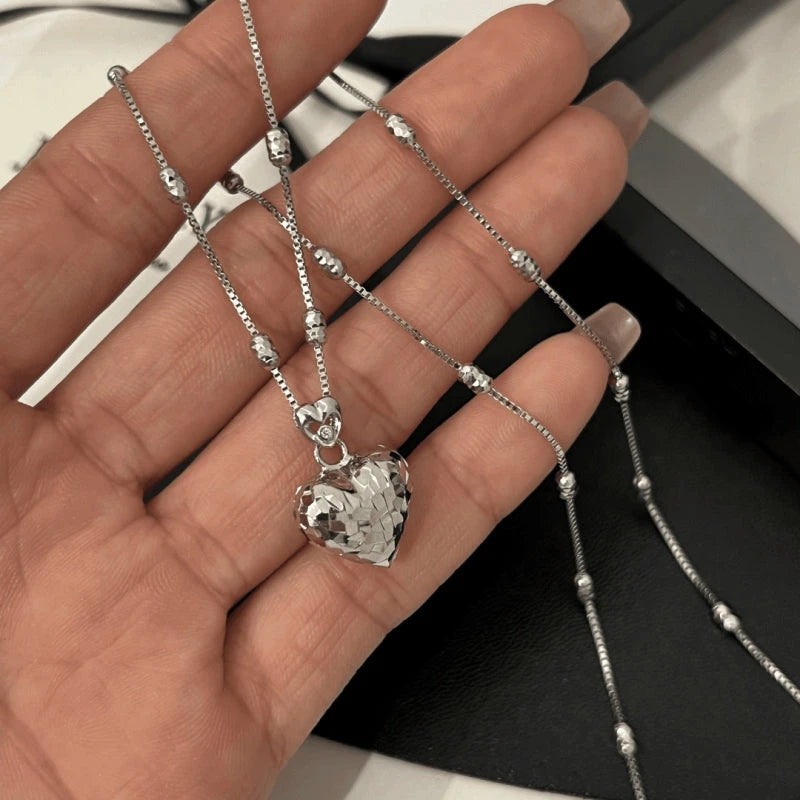 Close-up of the pendant and clasp on the Chain Tassel Earrings