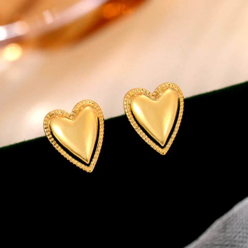 Close-up detail of the sparkling zircons and plating on the Double Heart Earrings