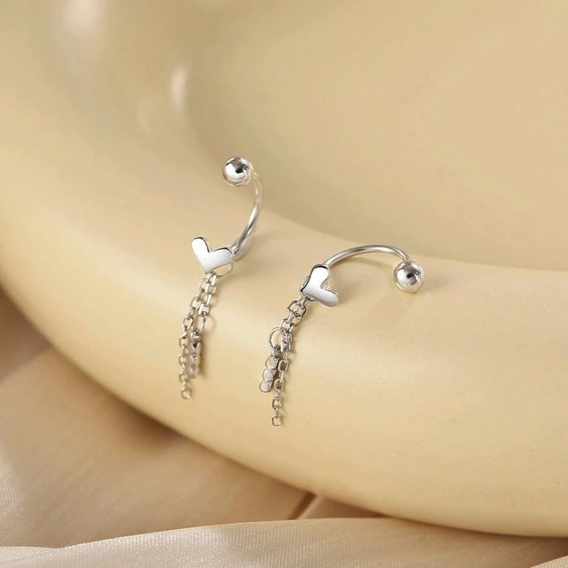 Close-up detail of the sparkling zircons and plating on the Layered Heart Earrings