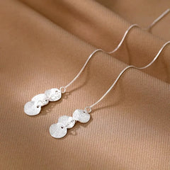 Close-up detail of the sparkling zircons and plating on the Heart Tassel Earrings