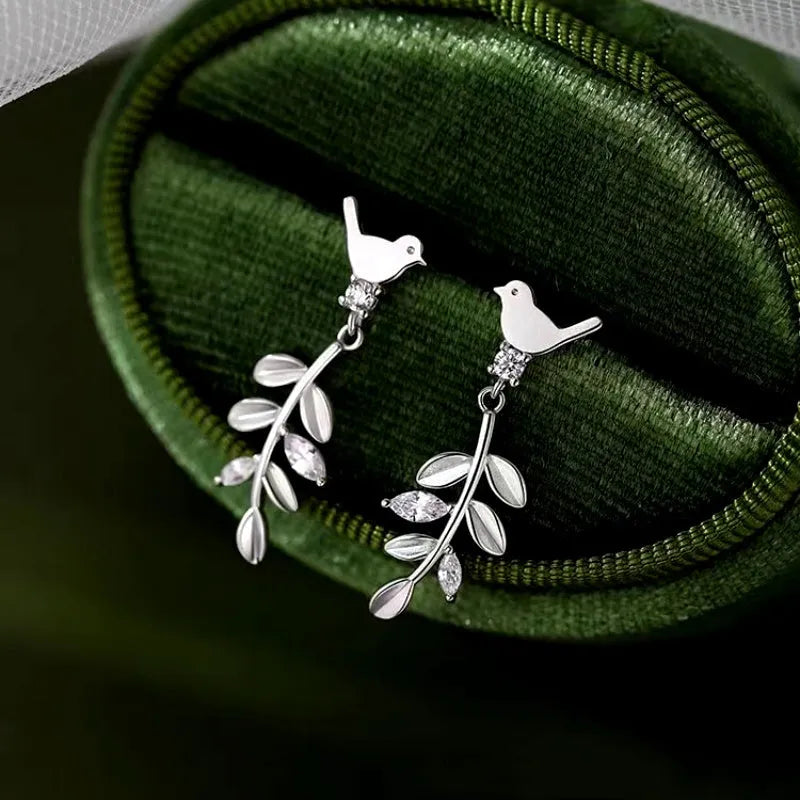 Close-up detail of the sparkling zircons and plating on the Heart Crawler Earrings