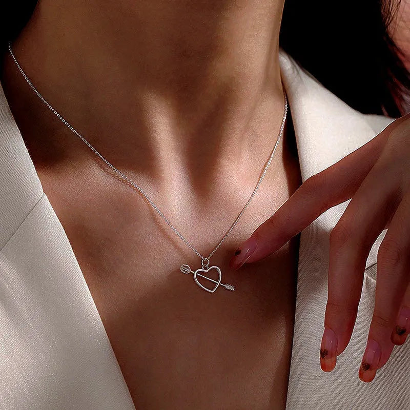 Sterling Silver Elegant One Arrow Through The Heart Clavicle Chain Necklace worn to showcase its length and pendant detail