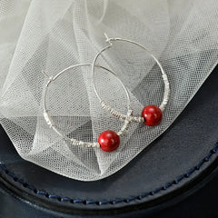 Angled view of the Sterling Silver Elegant Pearl Hoop Earrings