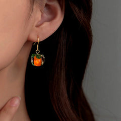 Close-up detail of the sparkling zircons and plating on the Heart Pearl Earrings