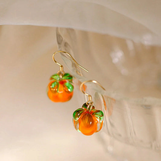 Model showcasing the dangle and style of the Sterling Silver Elegant Persimmon Ruyi Ear Hook Earrings
