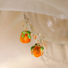 Model showcasing the dangle and style of the Sterling Silver Elegant Persimmon Ruyi Ear Hook Earrings