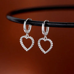 Close-up detail of the sparkling zircons and plating on the Heart Threader Earrings