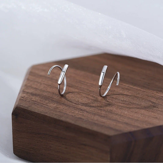 Model showcasing the dangle and style of the Sterling Silver Elegant Simple Spiral Earrings