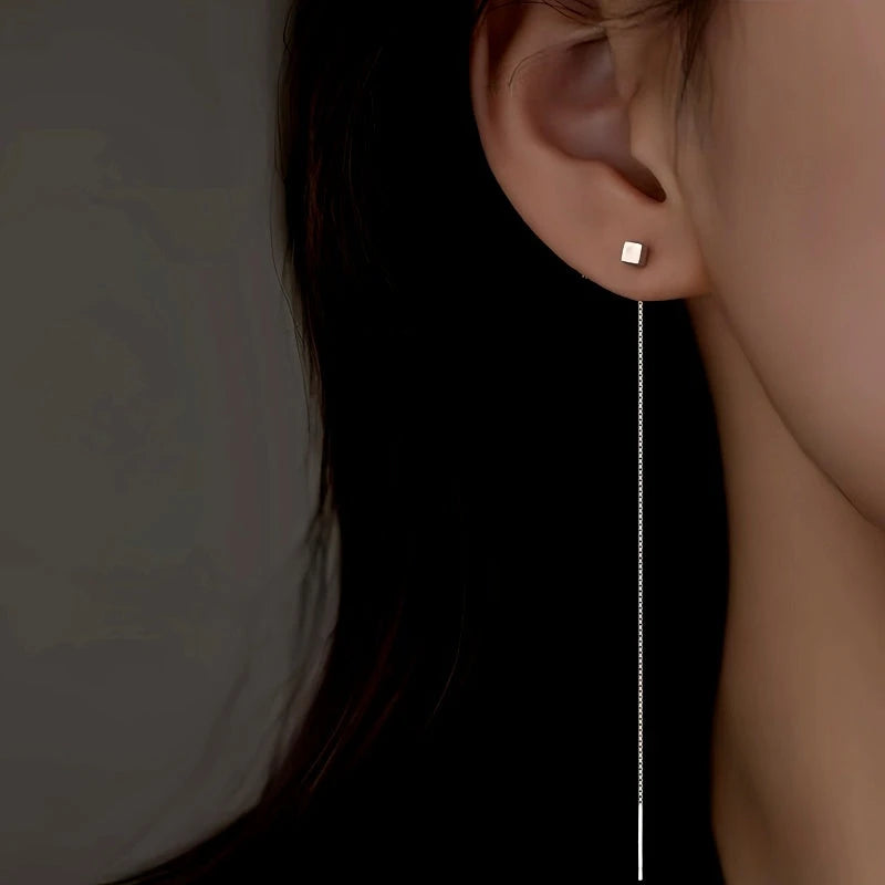 Model showcasing the dangle and style of the Sterling Silver Elegant Square Long Threader Earrings