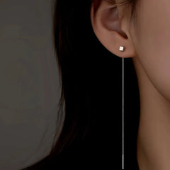 Model showcasing the dangle and style of the Sterling Silver Elegant Square Long Threader Earrings