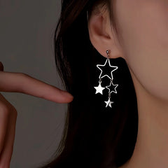 Model showcasing the dangle and style of the Sterling Silver Elegant Star Tassel Earrings