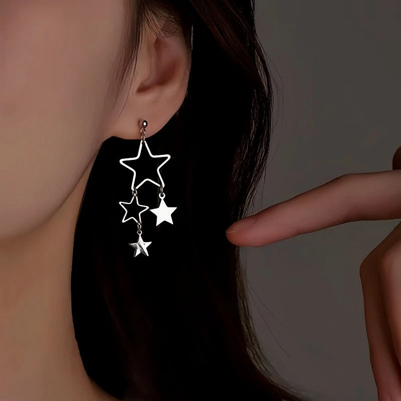Close-up detail of the sparkling zircons and plating on the Star Tassel Earrings