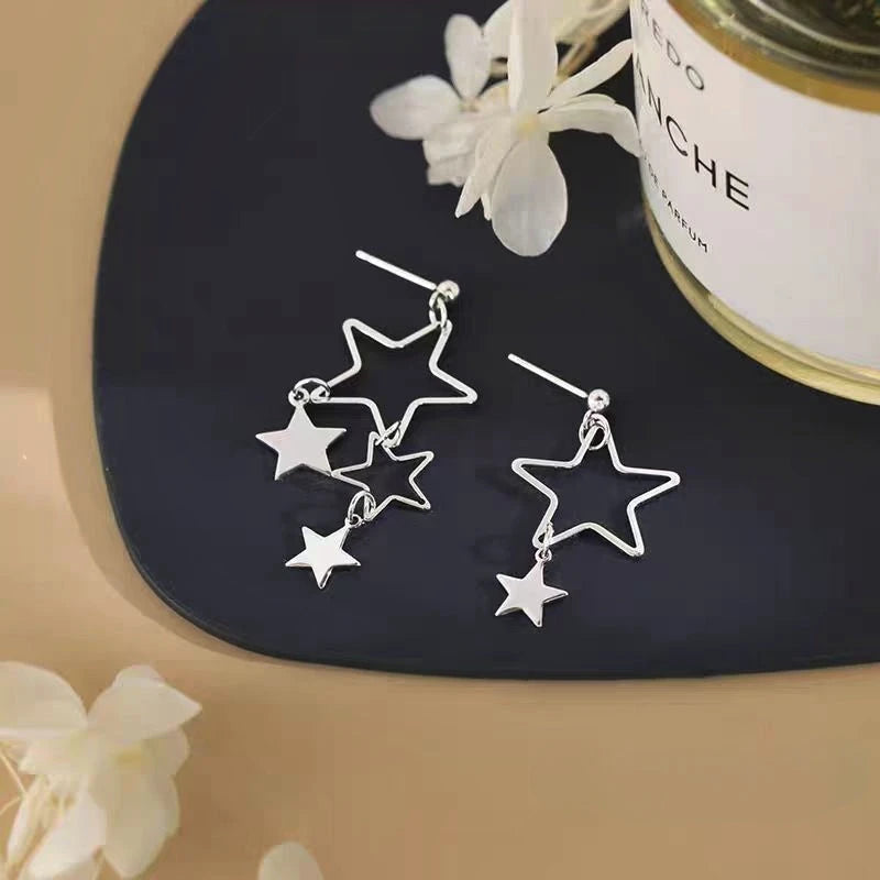 Angled view of the Sterling Silver Elegant Star Tassel Earrings