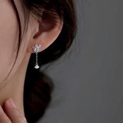 Model showcasing the dangle and style of the Sterling Silver Elegant Starfish Shell Earrings