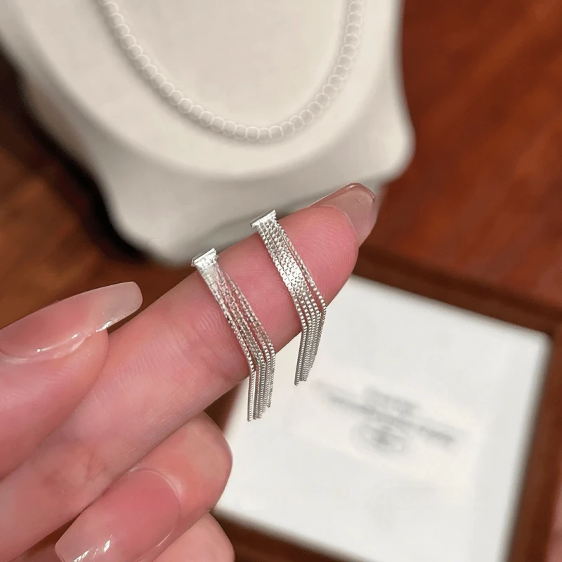Angled view of the Sterling Silver Elegant Tassel Earrings