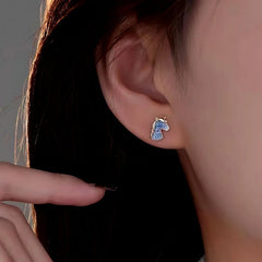 Close-up detail of the sparkling zircons and plating on the Unicorn Studs