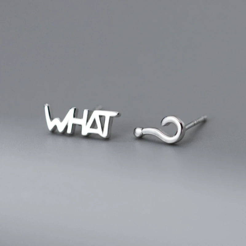 Model showcasing the dangle and style of the Sterling Silver Elegant WHAT? Stud Earrings