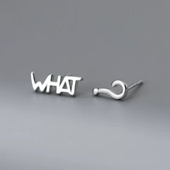 Model showcasing the dangle and style of the Sterling Silver Elegant WHAT? Stud Earrings