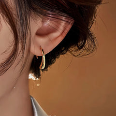 Model showcasing the dangle and style of the Sterling Silver Elegant Water Drop Ear Hooks
