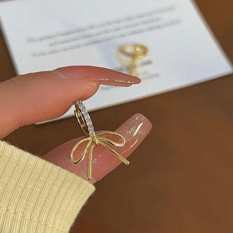 Angled view of the 14K Gold-Plated Elegant Zircon Bow Earrings