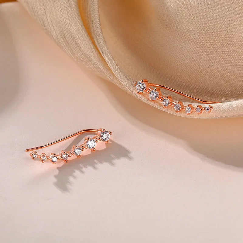 Model showcasing the dangle and style of the Sterling Silver Elegant Zircon Diamond Crawler Earrings