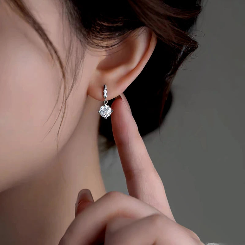 Model showcasing the dangle and style of the Sterling Silver Elegant Zircon Diamond Earrings