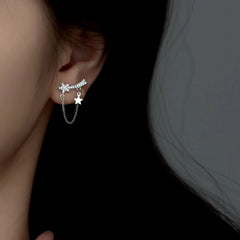 Model showcasing the dangle and style of the Sterling Silver Elegant Zircon Diamond Star Earrings