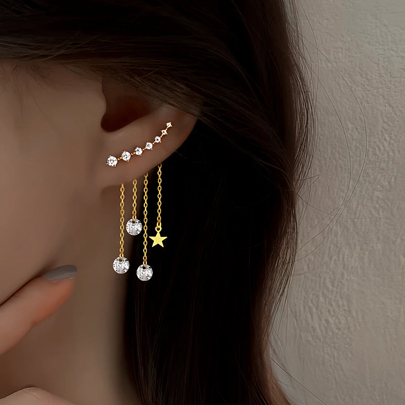 Model showcasing the dangle and style of the Sterling Silver Elegant Zircon Diamond Star Tassel Earrings