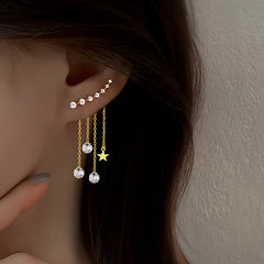 Model showcasing the dangle and style of the Sterling Silver Elegant Zircon Diamond Star Tassel Earrings
