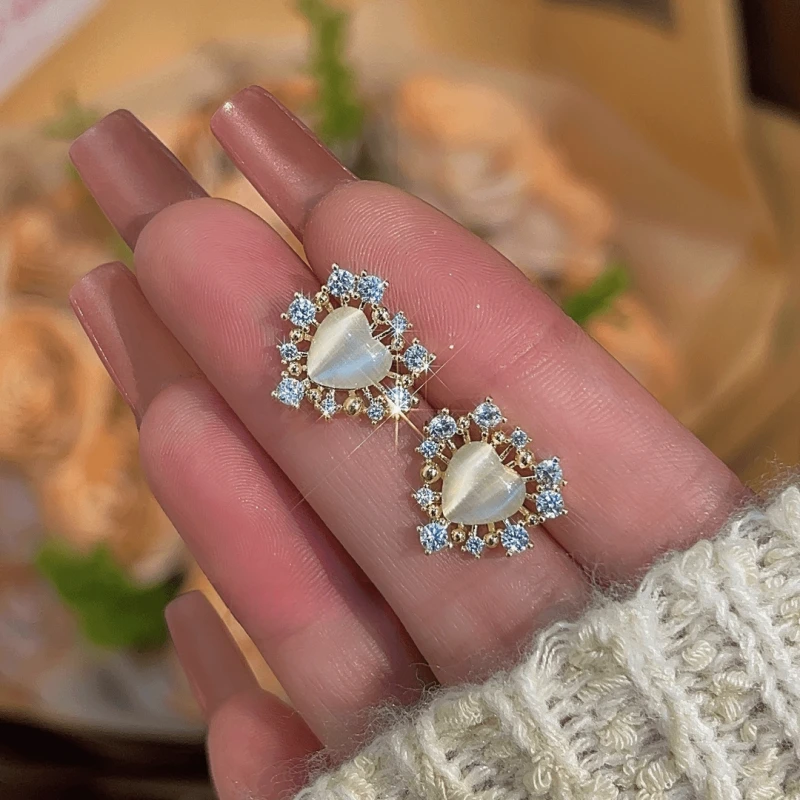 Angled view of the 14K Gold-Plated Elegant Zircon Heart Stud Earrings