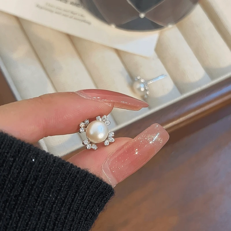 Angled view of the 14K Golden-Plated Elegant Zircon Lucky Clover Bead Stud Earrings