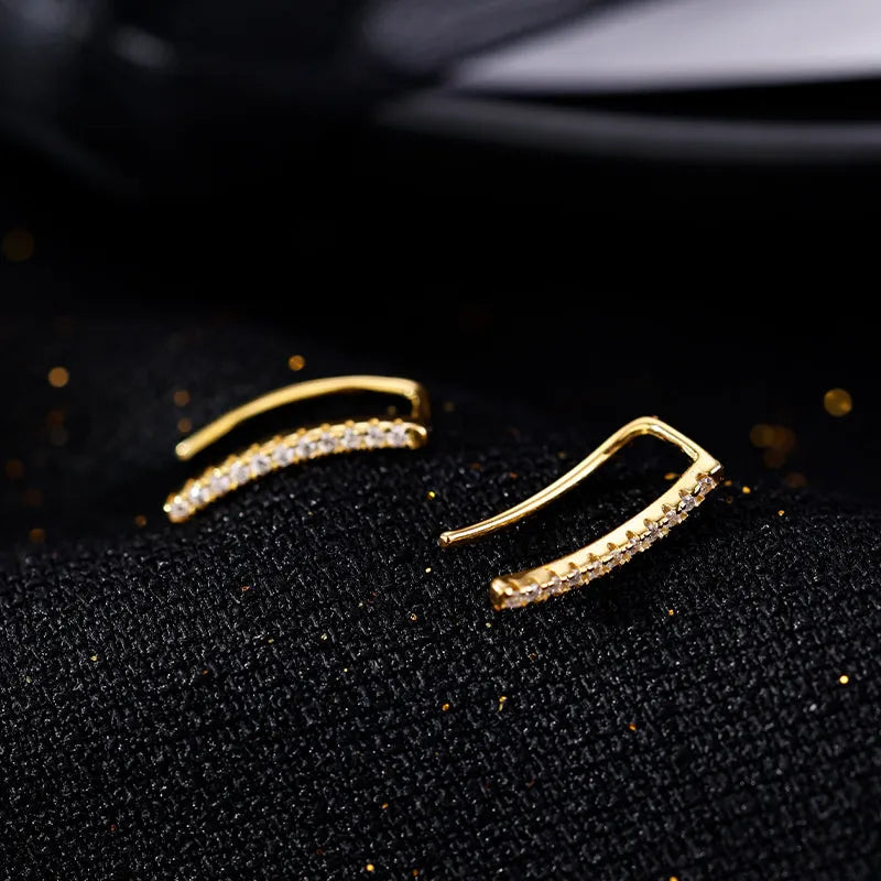 Model showcasing the dangle and style of the Sterling Silver Elegant Zircon U-Shaped Earrings