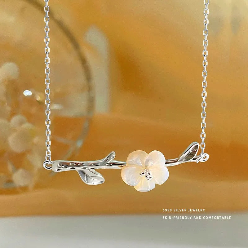 Close-up of the pendant and clasp on the Flower Branch Necklace