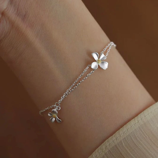 Model wearing the Sterling Silver Flower Bracelet to highlight its design on the wrist