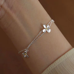 Model wearing the Sterling Silver Flower Bracelet to highlight its design on the wrist