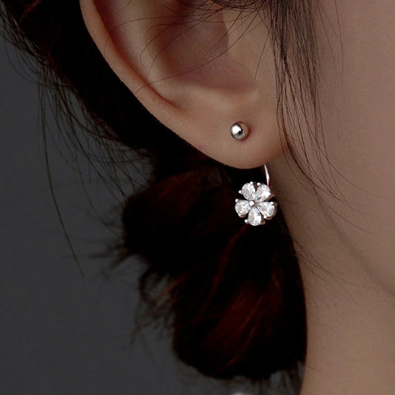 Angled view of the Sterling Silver Flower Jacket Earrings