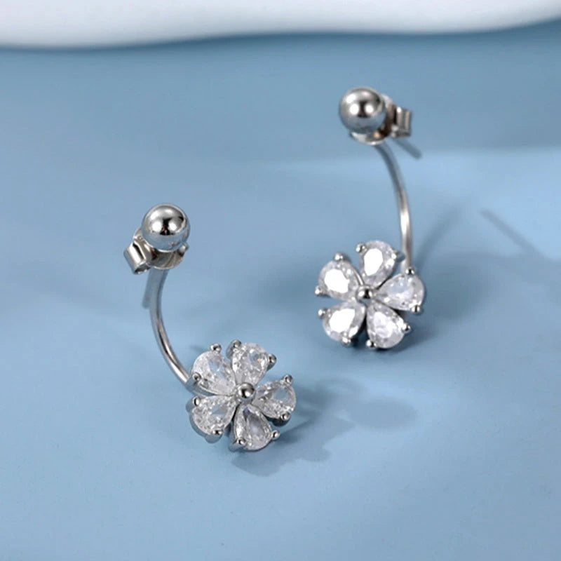 Model showcasing the dangle and style of the Sterling Silver Flower Jacket Earrings