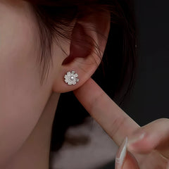 Model showcasing the dangle and style of the Sterling Silver Flower Pearl Stud Earrings