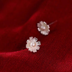 Angled view of the Sterling Silver Flower Pearl Stud Earrings