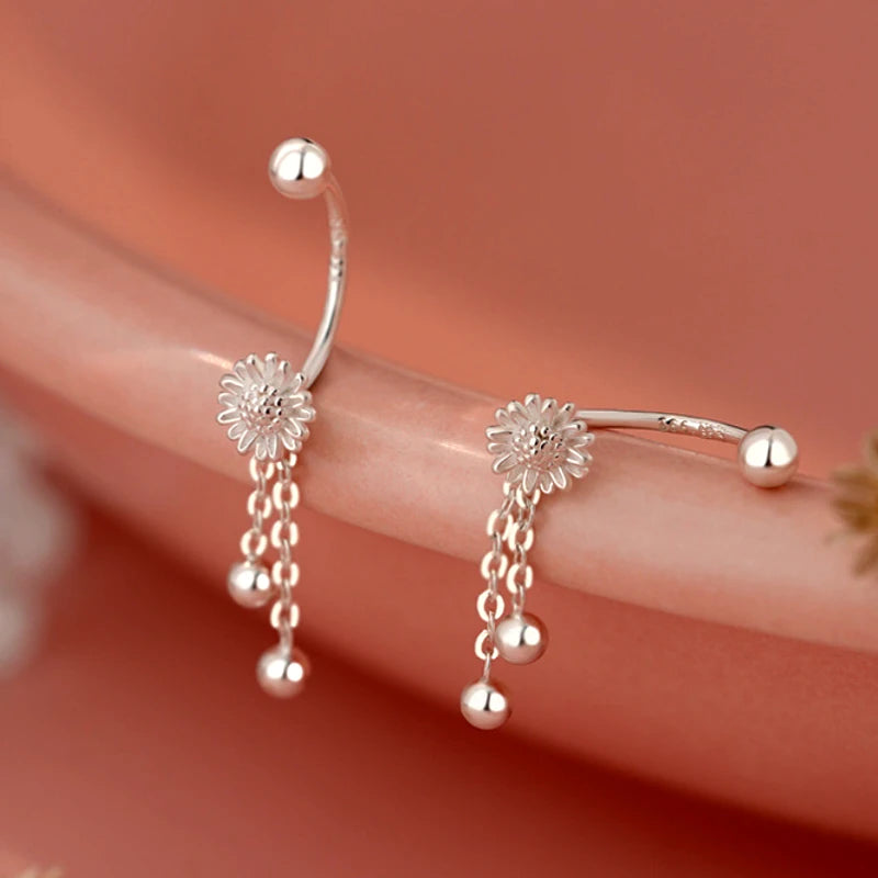 Close-up detail of the sparkling zircons and plating on the Tassel Earrings