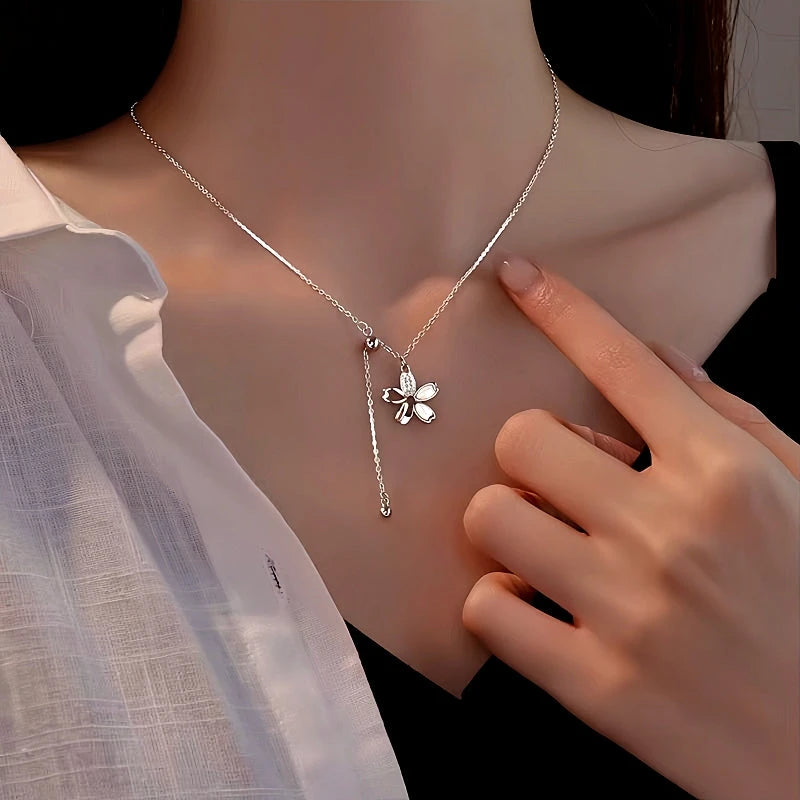 Sterling Silver Flower Tassel Necklace worn to showcase its length and pendant detail