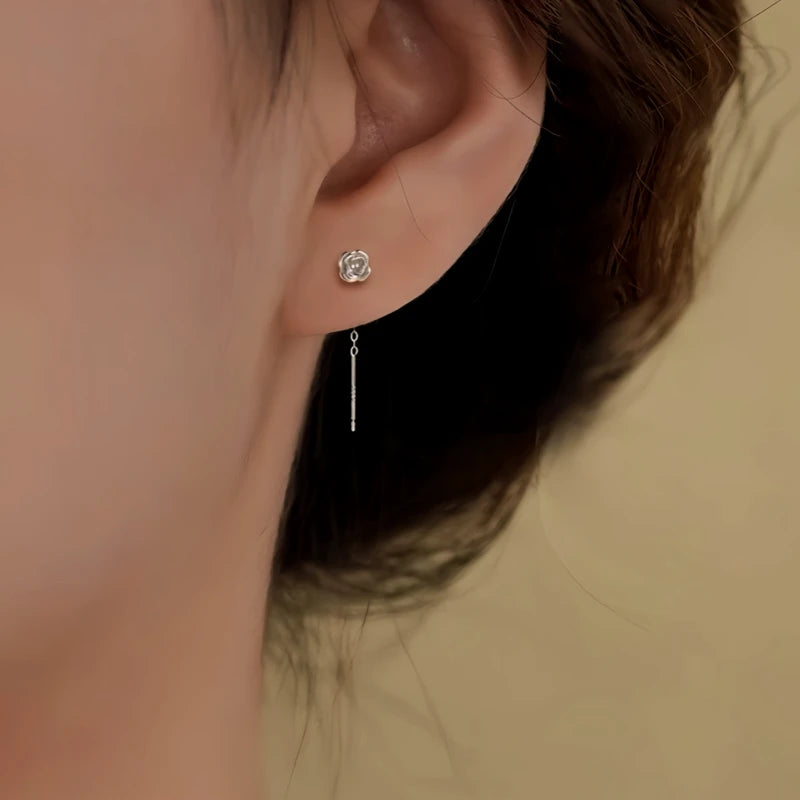 Model showcasing the dangle and style of the Sterling Silver Flower Threader Earrings