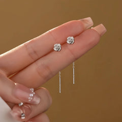 Angled view of the Sterling Silver Flower Threader Earrings