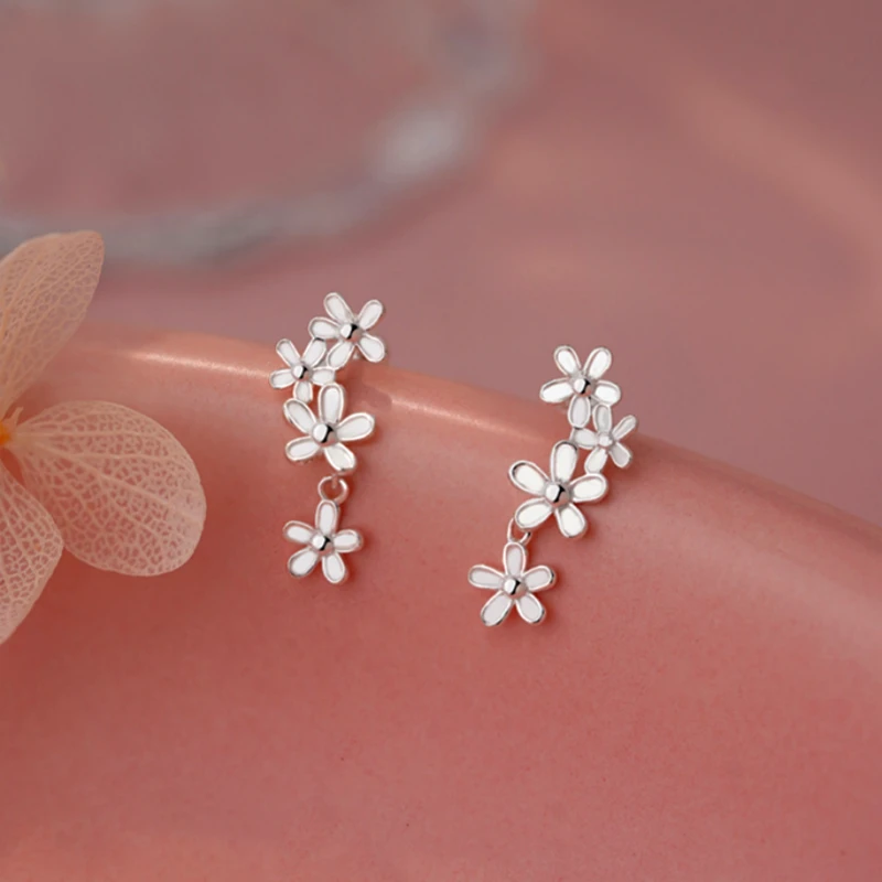 Close-up detail of the sparkling zircons and plating on the Tassel Screw Earrings