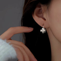 Close-up detail of the sparkling zircons and plating on the Flower Ear Hooks
