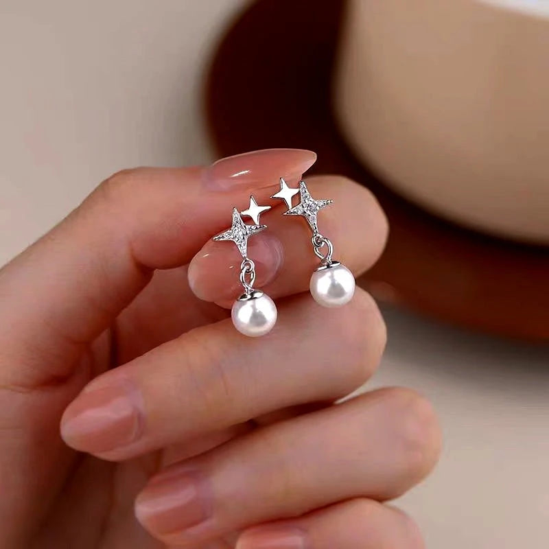 Close-up detail of the sparkling zircons and plating on the Star Pearl Earrings